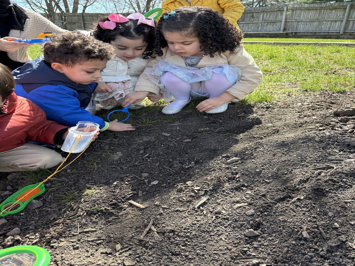 Iqra Learning students planting seeds and exploring gardening outdoors